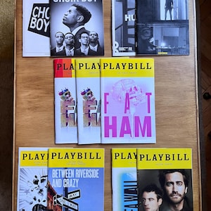 May include: A selection of Playbill theatre programmes with yellow headers. Titles include "Choir Boy," "The Humans," "Fat Ham," "Between Riverside and Crazy," and "Sea Wall/A Life." The programmes feature images of actors and show titles.