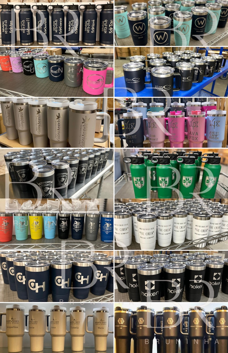 May include: A collection of various stainless steel tumblers with different designs and engravings. The tumblers are in various colours, including black, white, blue, green, pink, and grey. Some tumblers have handles, while others do not. The tumblers are arranged in rows on shelves and tables.