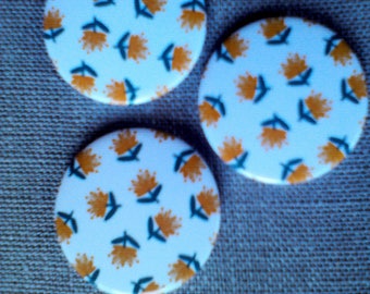 Button magnets round orange eyelet pattern