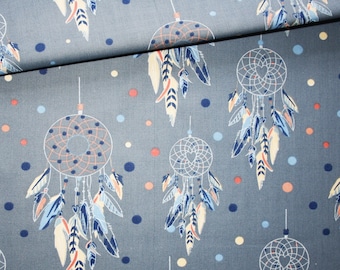 Dreamcatcher fabric on a denim blue background in oeko tex printed cotton
