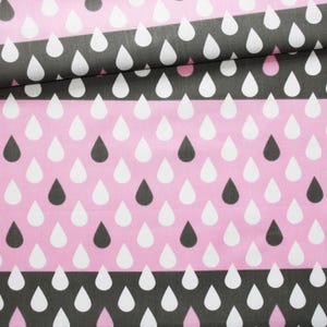 Black and dark grey white drops fabric on an Oeko Tex printed cotton Pastel pink background