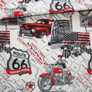 May include: A white fabric with a black and red design featuring a map of the United States with Route 66 highlighted. The map includes cities and states along the route, including Los Angeles, Chicago, Pontiac, Illinois, and Holbrook, Arizona. The design also features a vintage car and a motorcycle.
