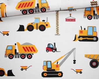 Construction truck fabric on a white background in oeko tex printed cotton