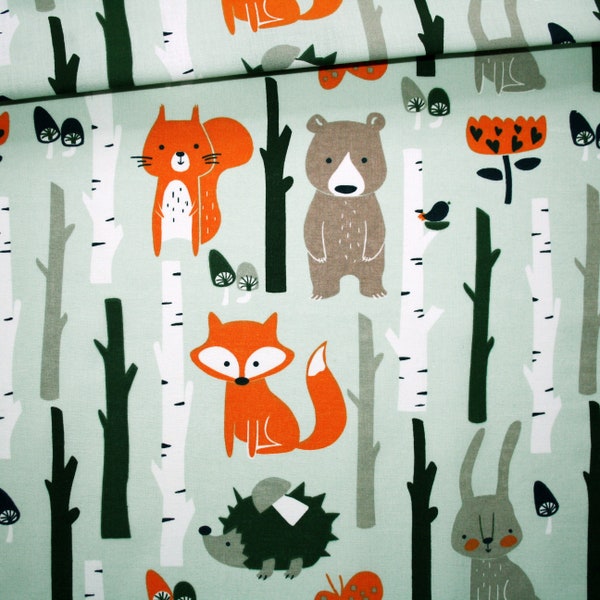 Forest animal fabric on a light mint green background in cotton printed oeko tex