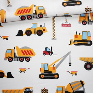 Construction truck fabric on a white background in oeko tex printed cotton