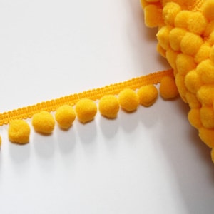 Galon pompoms yellow orange 10 mm sold by the meter