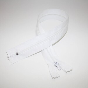 May include: White zipper with a metal slider. The zipper is approximately 18 inches long.