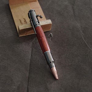 Hunting pen, bullet rifle,