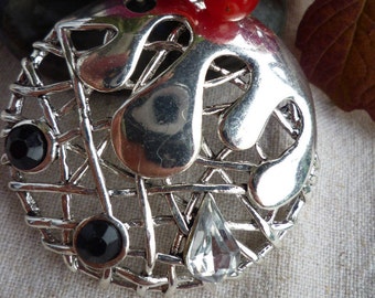 Collier  pendentif en métal argenté design entrelacé coulures