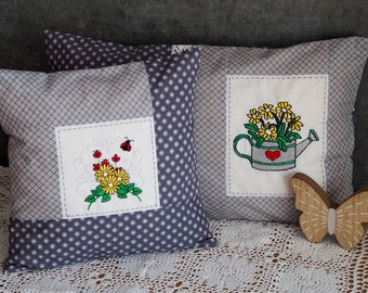 Embroidered floral cushions in a set