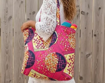 Large lined bag with pocket, tote bag in wax print with target, disc, and rosette design. Large shopping bag.