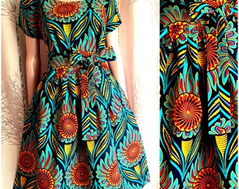 Several lengths, African style wax dress rosette or target and like peacock feathers and foliage