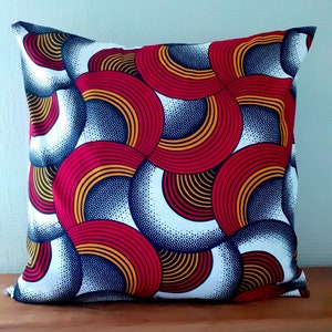 Several dimensions of African style wax cushion cover with graphic print in red, blue, orange and white