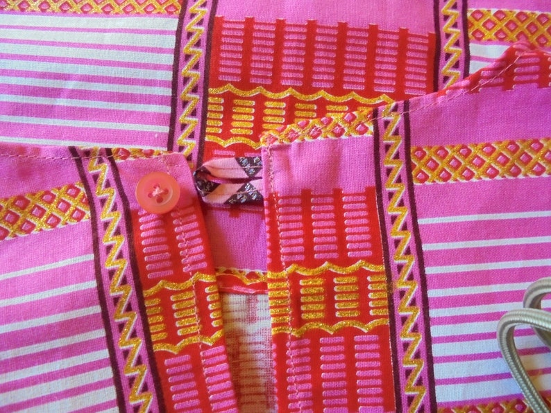 Summer 18 months 2 years and 3 years girl dress printed on a pink background and pink wax.