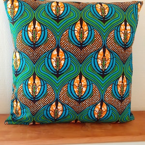 Several dimensions cushion cover in wax African style printed target disc blue and red rosette