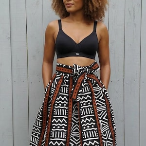 3 lengths of African-style wax print skirt with bogolan and cowrie shells