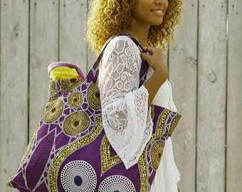 Large lined bag with pocket, tote bag in wax print with target, disc, and rosette design. Large shopping bag.