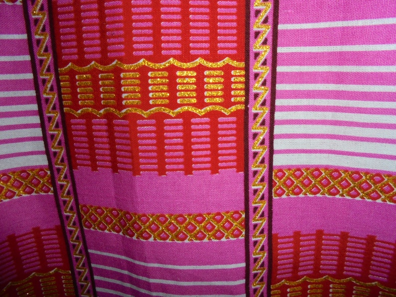 Summer 18 months 2 years and 3 years girl dress printed on a pink background and pink wax.