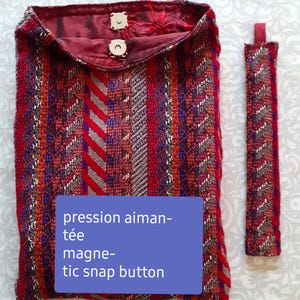May include: A red, blue, and silver patterned fabric pouch with a magnetic snap closure and a matching fabric strap. The pouch has the text "pression aiman-tée magne-tic snap button" printed on it.