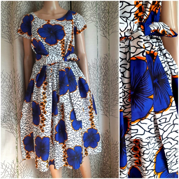 Several lengths, African style dress in wax cotton printed with large flowers, flared for weddings and ceremonies