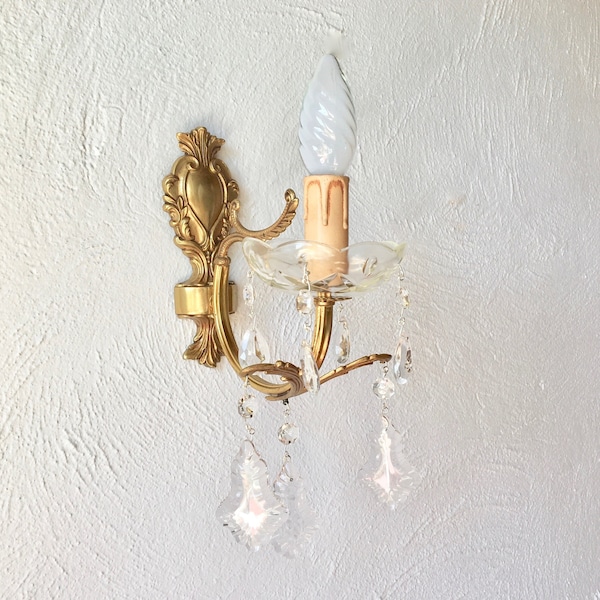 Old golden wall lamp with tassels