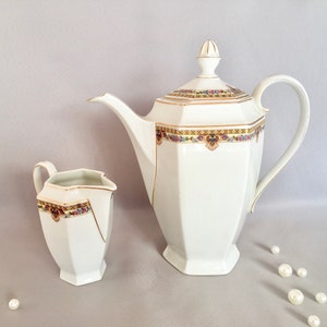 Antique porcelain coffee pot and matching milk jug