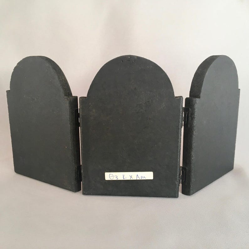 May include: A black wooden triptych with three panels. The center panel has a white label with the text "03 L x L x L" written in blue ink.
