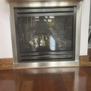 Fireplace surround: CUSTOM decorative seamless stainless steel fire surround