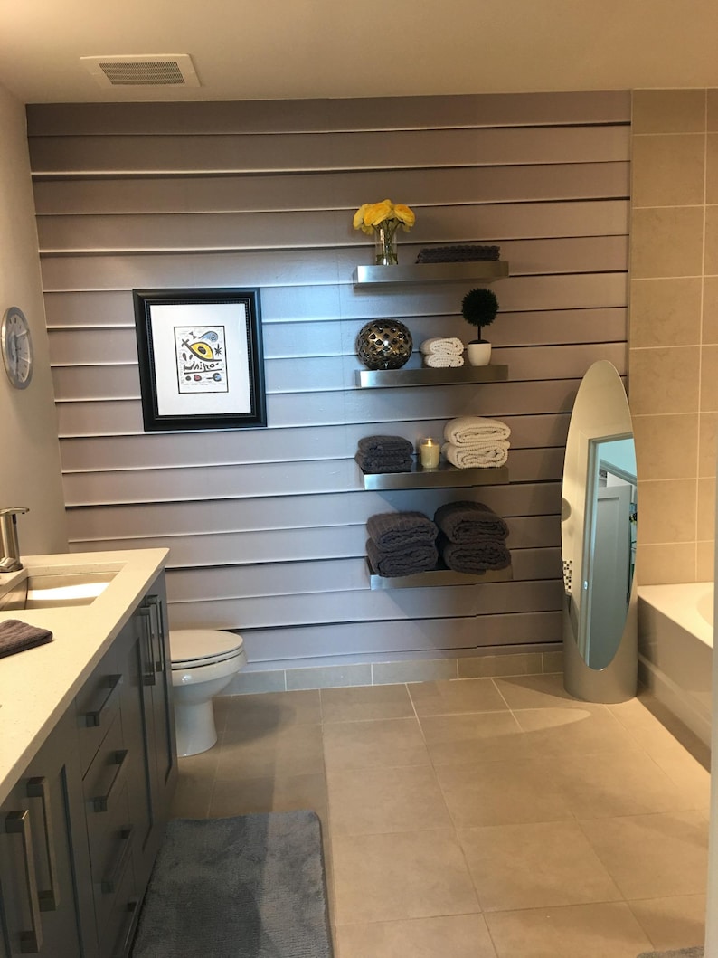 Stainless steel shelves in a bathroom with a soft gray palette. Perfect for towels, candles, and decor. Waterproof, rust-proof, and seamless — ideal for humid spaces.
Tags:
bathroom shelf, towel shelf, waterproof, stainless, ponoma, wall decor, spa shelf, modern bath, floating shelf, durable