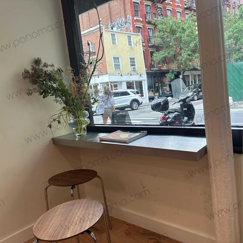 Brushed stainless floating ledge — used as café window bar counter. Rustproof and water resistant.
Tags: cafe shelf, stainless steel ledge, brushed metal shelf, window bar.