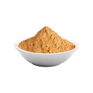 May include: A white bowl filled with a mound of light brown powder.