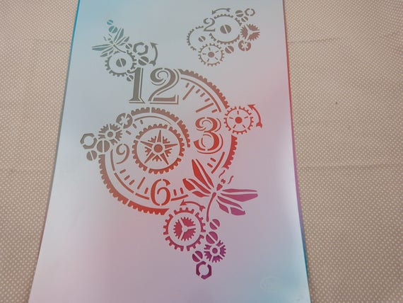 Pochoir souple stencil "horloge" en plastique