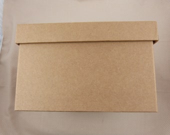 May include: A plain brown cardboard box with a lid.