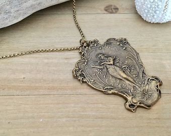 Marcella necklace featuring Victorian woman with harp stamping