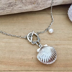 Riambel silver plated necklace featuring shell locket with pearl