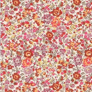 May include: A white fabric with a repeating pattern of small pink, red, orange, and yellow flowers. The flowers are arranged in a random pattern on a white background.