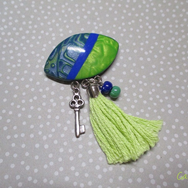 Blue and green oval brooch with matching green pompom and pearl charm