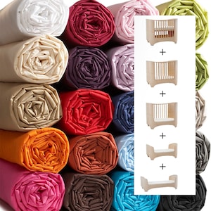 Peut inclure: Tissus roulés de différentes couleurs, dont blanc, beige, rouge, violet, rose, orange, bleu et turquoise. Un lit bébé modulaire est présenté dans différentes configurations, du berceau au lit pour enfant.