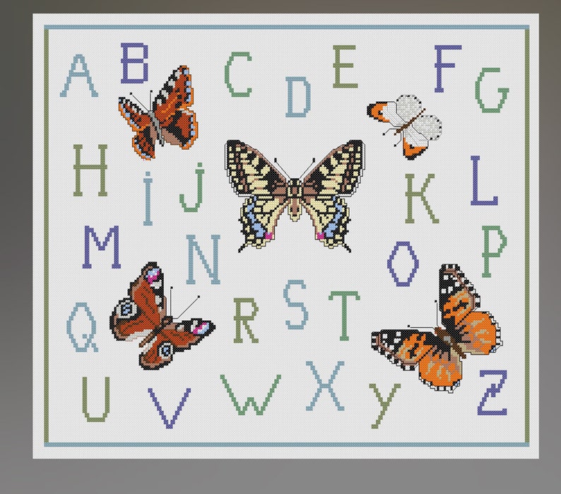 May include: Cross-stitch design featuring the alphabet with colorful butterflies. The letters are in shades of blue, green, and purple. The butterflies have orange, brown, yellow, and white wings. The design is framed with a light blue border.