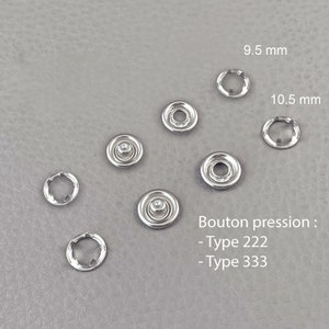 Puede incluir: Una colección de broches de presión plateados y sus componentes de anillo correspondientes. La imagen incluye cierres de varios tamaños, con medidas de 9,5 mm y 10,5 mm. El texto "Bouton pression" es visible, junto con "Type 222" y "Type 333".