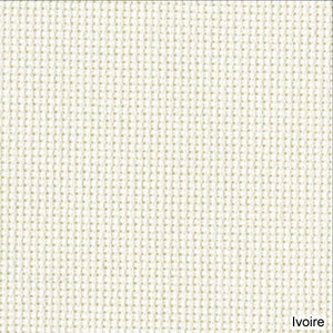 May include: Close-up of a textured ivory fabric. The weave is tight, creating a grid-like pattern. The color is a warm off-white, with a subtle variation in tone across the surface. The word "Ivoire" is printed in the bottom right corner.