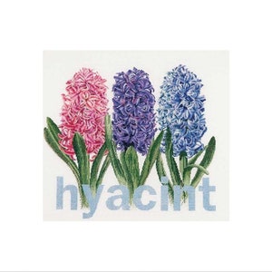 May include: A cross-stitch design featuring three hyacinth flowers in pink, purple, and blue, with green leaves. The word "hyacinth" is stitched in light blue below the flowers, set against a white background.