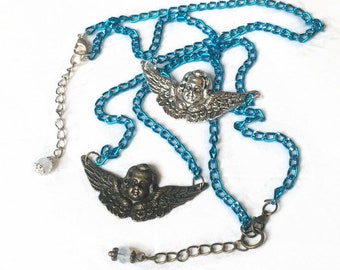 Choker necklace pendant head of guardian angel/cherub, large wings, bronze or silver on shiny turquoise blue chain