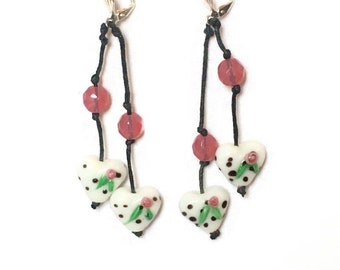 Earrings, white lampwork heart beads, black polka dots, pink flower, leaf and plain round faceted pink opal. Licorice of yesteryear.