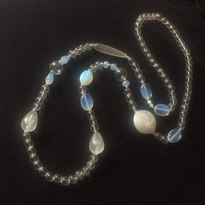 Long white opal necklace, opaline, sky blue, silver, transparent, asymmetrical, blown glass globe/bubble, baroque, poetic, airy