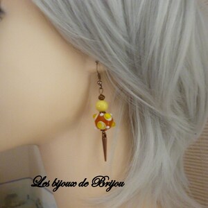 hanging earrings made of glass beads, copper metal tip pendants and copper metal beads
