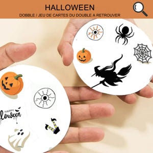 May include: Two white circular Halloween-themed game cards with various spooky illustrations. One card features a jack-o'-lantern, an eye, a ghost, and text that says "Happy Halloween". The other card has a spider, a web, a witch on a broom, and a jack-o'-lantern.