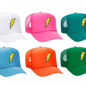 May include: Six trucker hats with a yellow lightning bolt design. The hats are in different colours: white, pink, teal, light blue, orange, and green.
