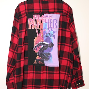 May include: Red and black plaid flannel shirt with a Black Panther comic book character patch sewn on the back.