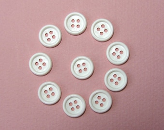 Boutons ronds 12,5 mm synthétique  blanc 4 trous vendus par lot de 35 couture création